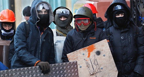 Demonstranter i Kiev i Ukraina. Foto: Sergej Grits/TT.