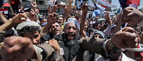 Folk i Jemen protesterar mot landets president. Foto: Muhammed Muheisen/Scanpix