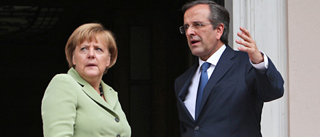 Angela Merkel och Antonis Samaras. Foto: Thanassis Stavrakis/Scanpix.