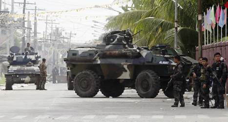 Regeringens soldater krigar mot rebeller i landet Filippinerna.
Foto: Bullit Marquez/Scanpix.
