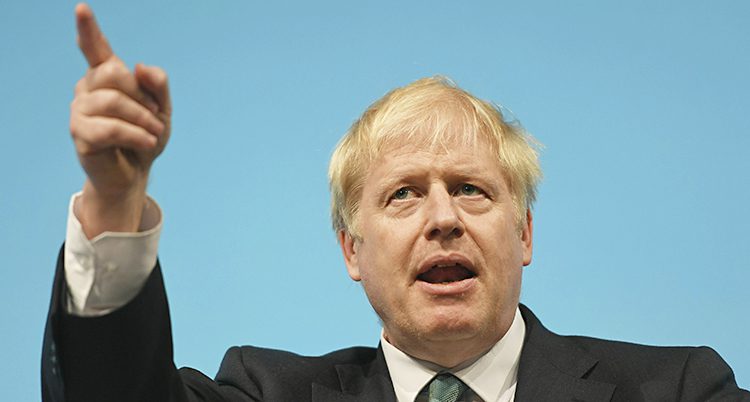 Boris Johnson har blont hår och pekar med ett finger
