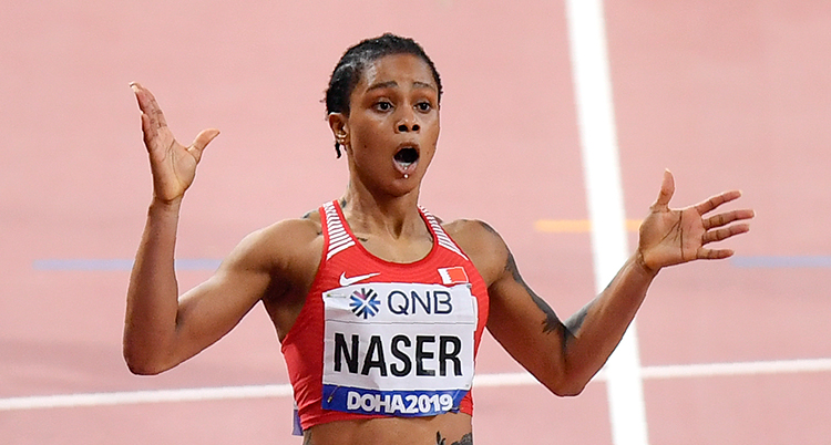 Salwa Eid Naser, of Bahrain, wins gold in the women's 400 meter final at the World Athletics Championships in Doha, Qatar, Thursday, Oct. 3, 2019. (AP Photo/Martin Meissner) ATH831 sträcker ut armarna. Hon ser förvånad ut.