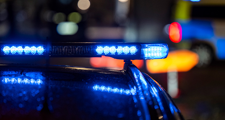 Blå lampor på en polisbil.