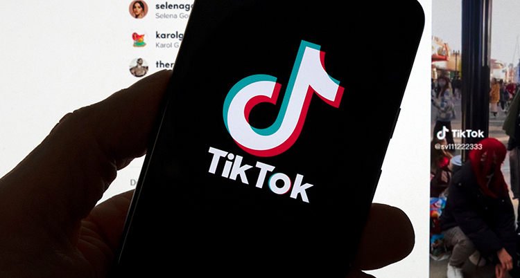 Hand som håller en telefon med Tiktok på skärmen.