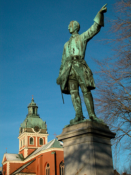 Karl XLL pekar med ena handen.